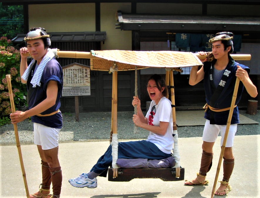 getting the royal treatment in Japan, being carried on a palanquin