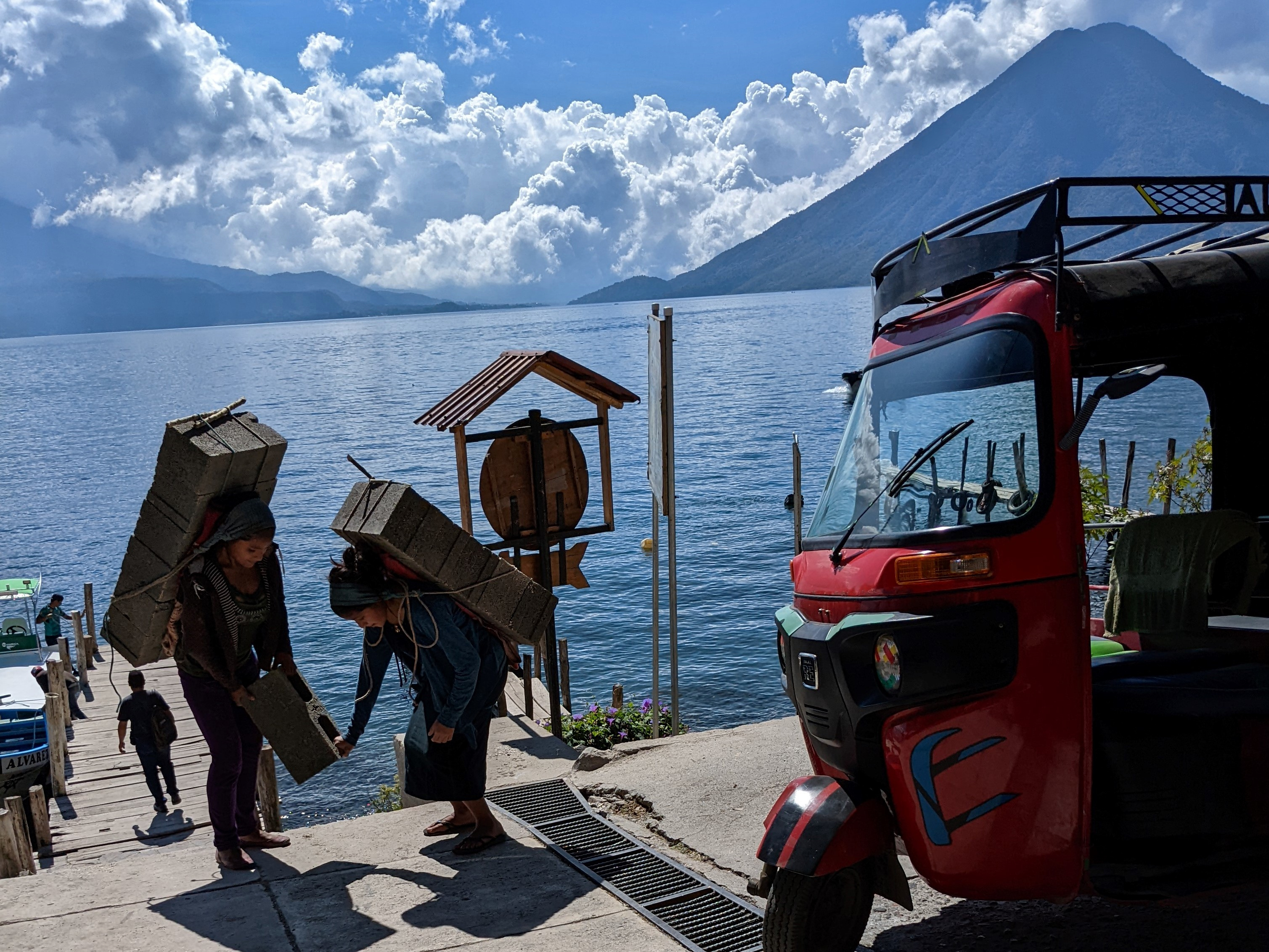 women carrying stone blocks, Lake Atitlan, Guatemala