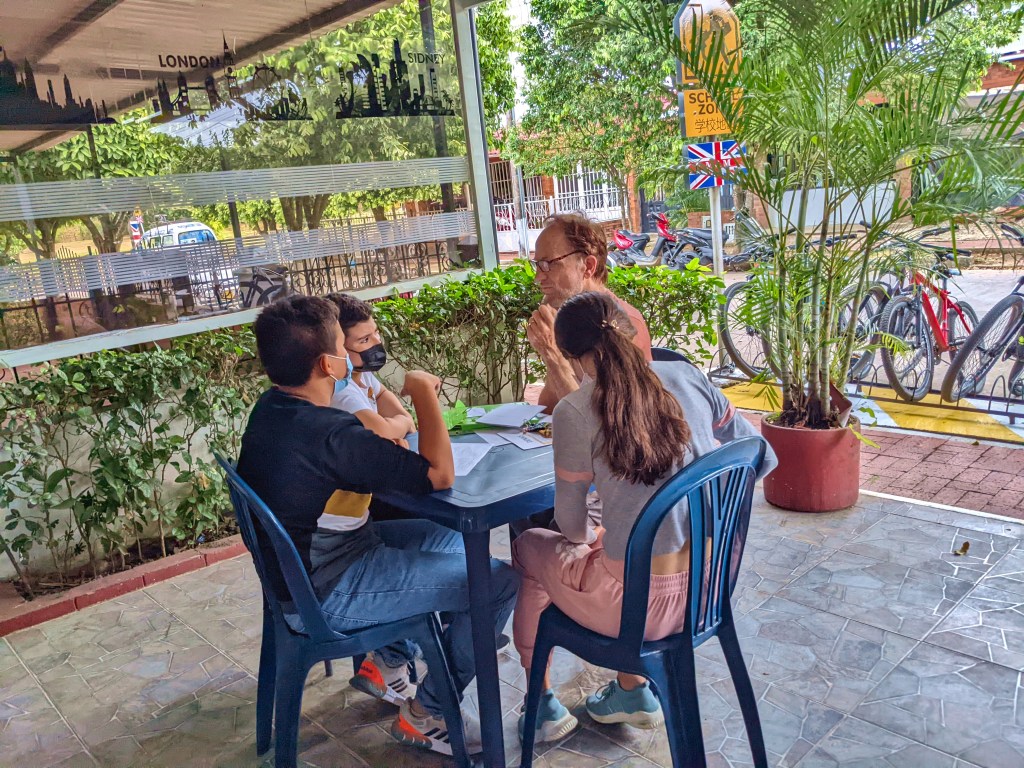 Dennis teaching writing skills to students in Villanueva, Colombia