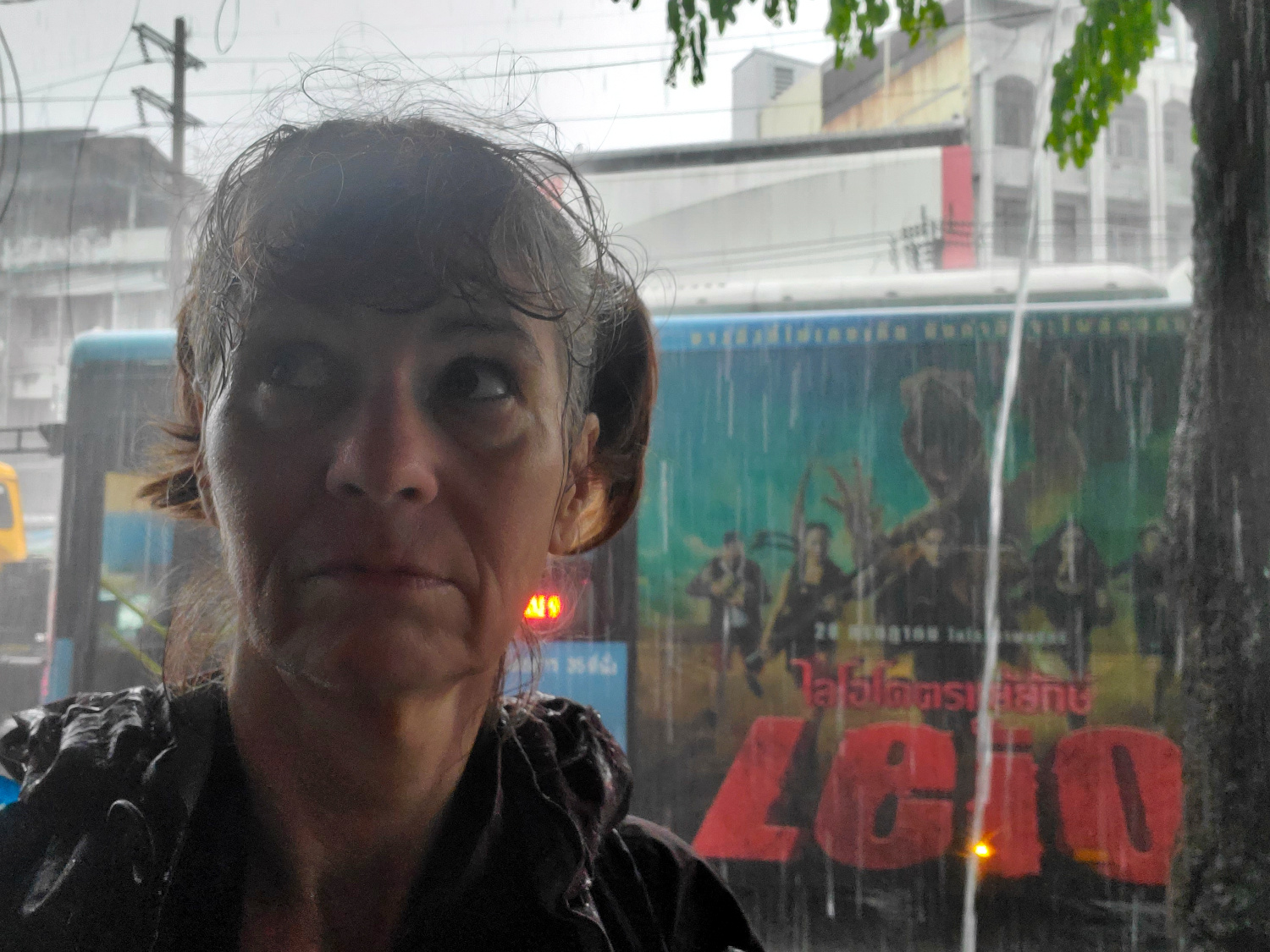 unrelenting rain, traveler gets drenched while monsters lurk in the background