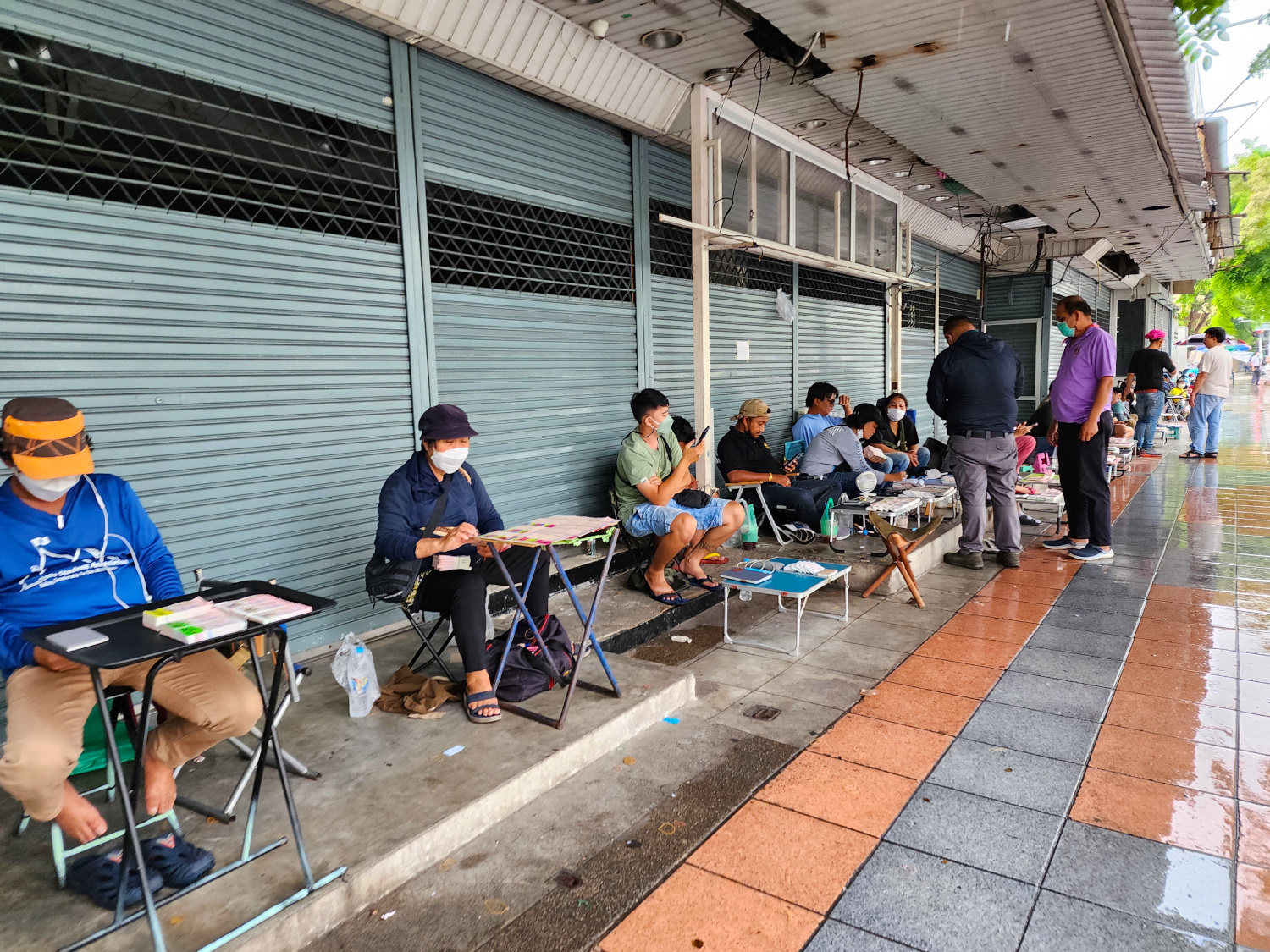 more lotto ticket sellers than customers on the streets of Bangkok, Thailand