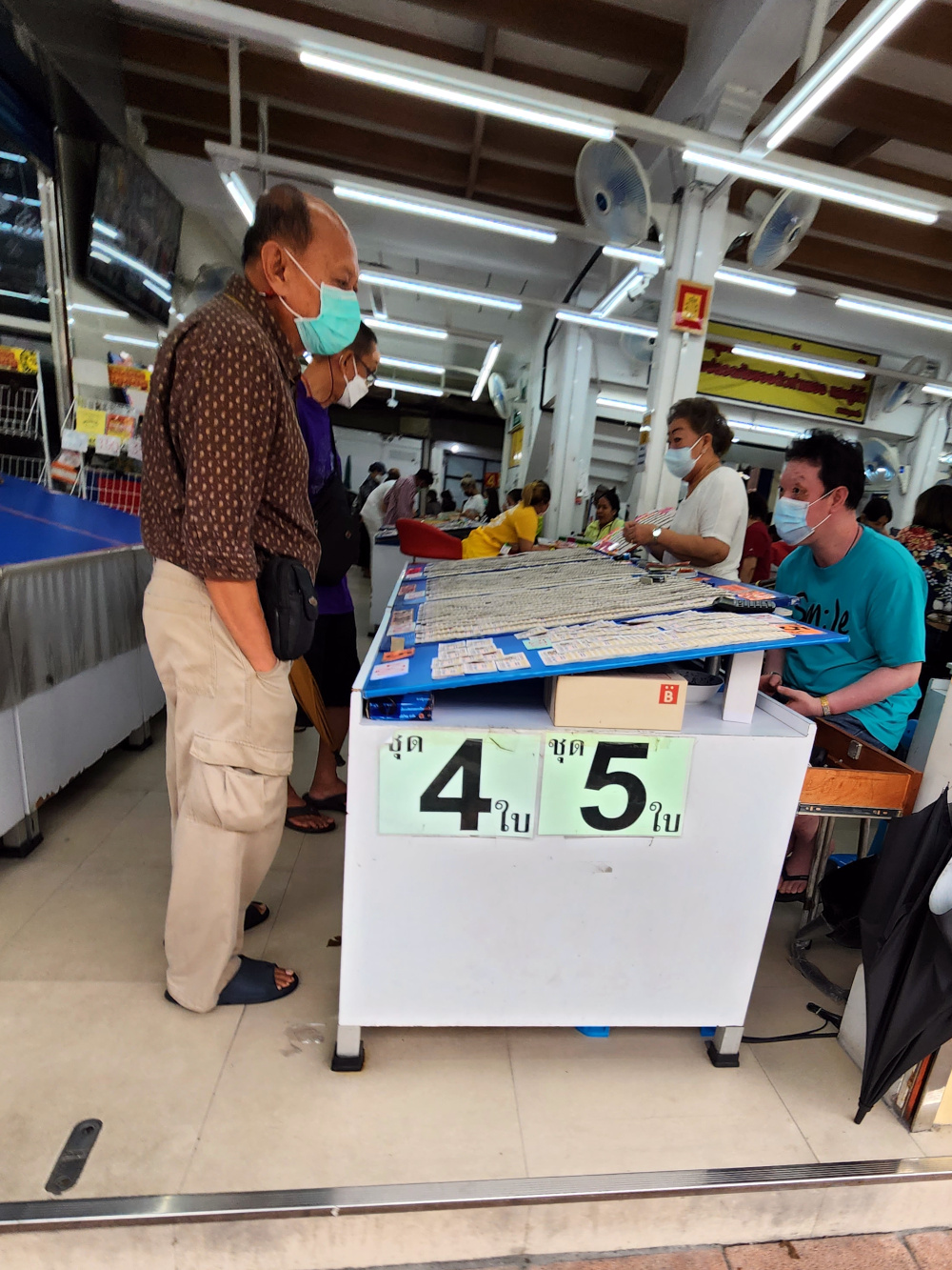 lotto tickets for sale - more salesman than customers Bangkok, Thailand