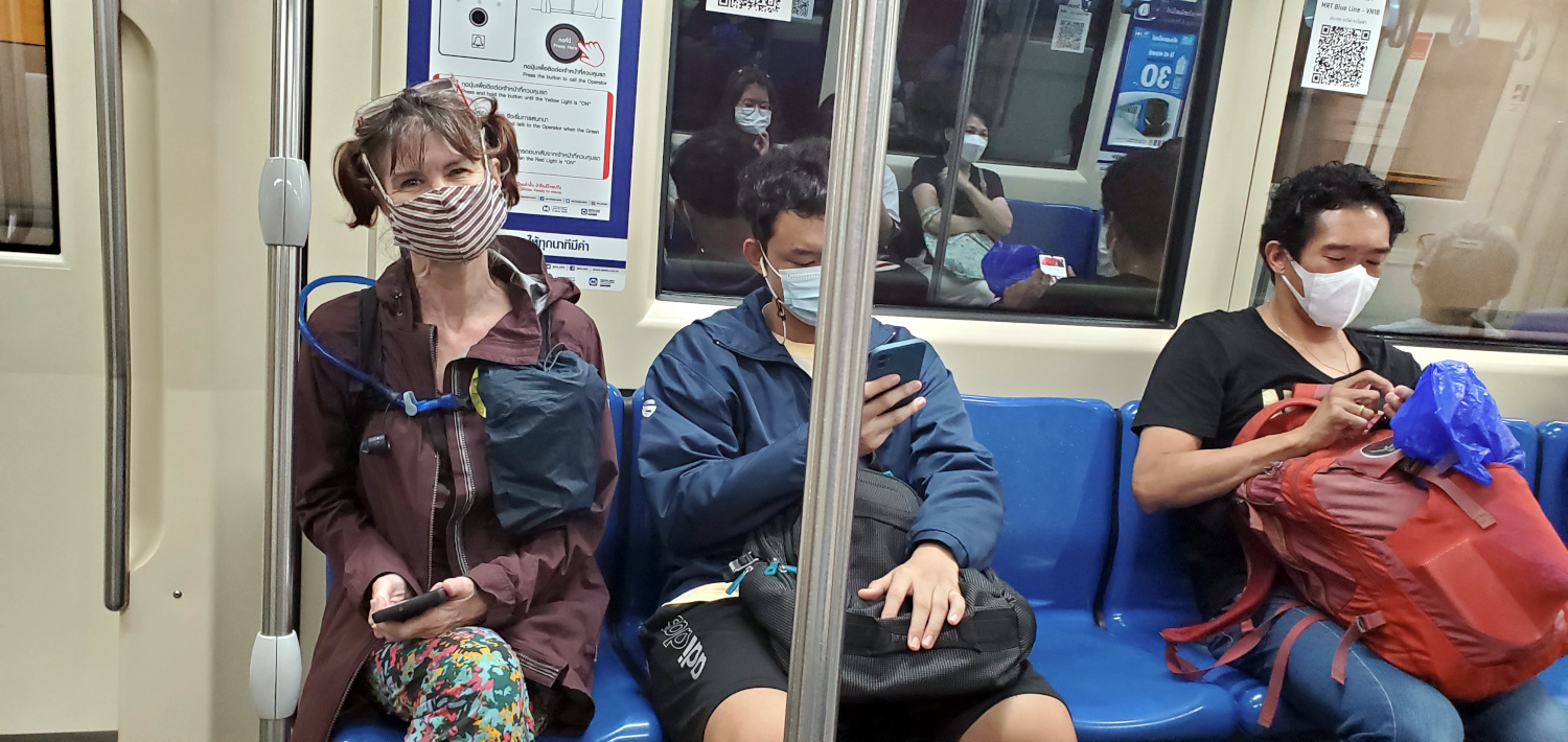 frugal travel blogger catching the train Bangkok, Thailand
