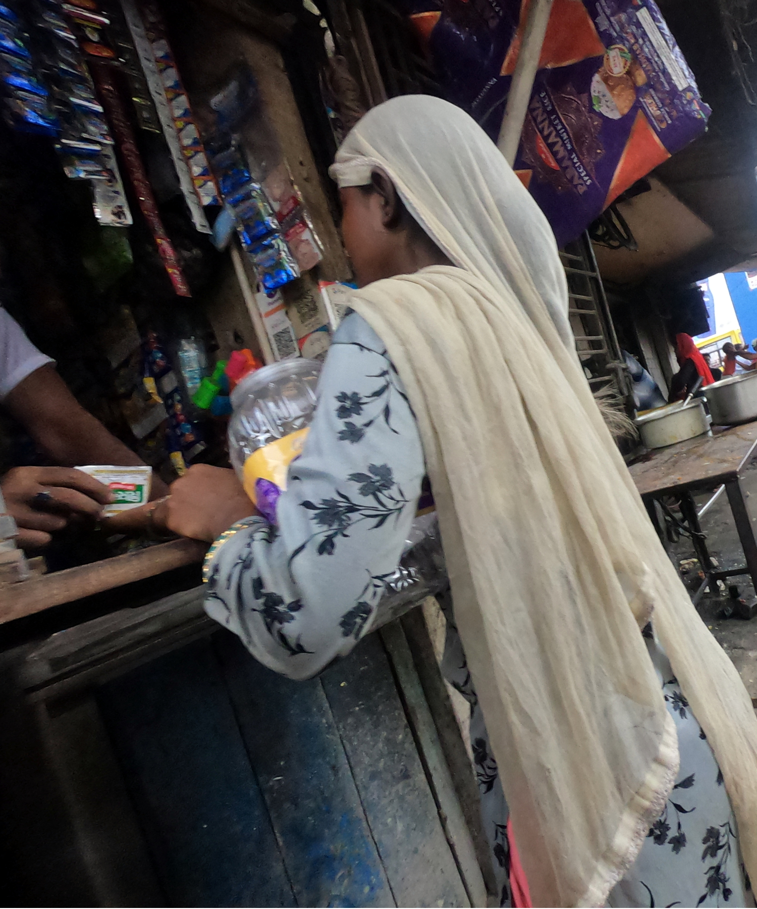 Lady buying from a local merchant in Kolkata