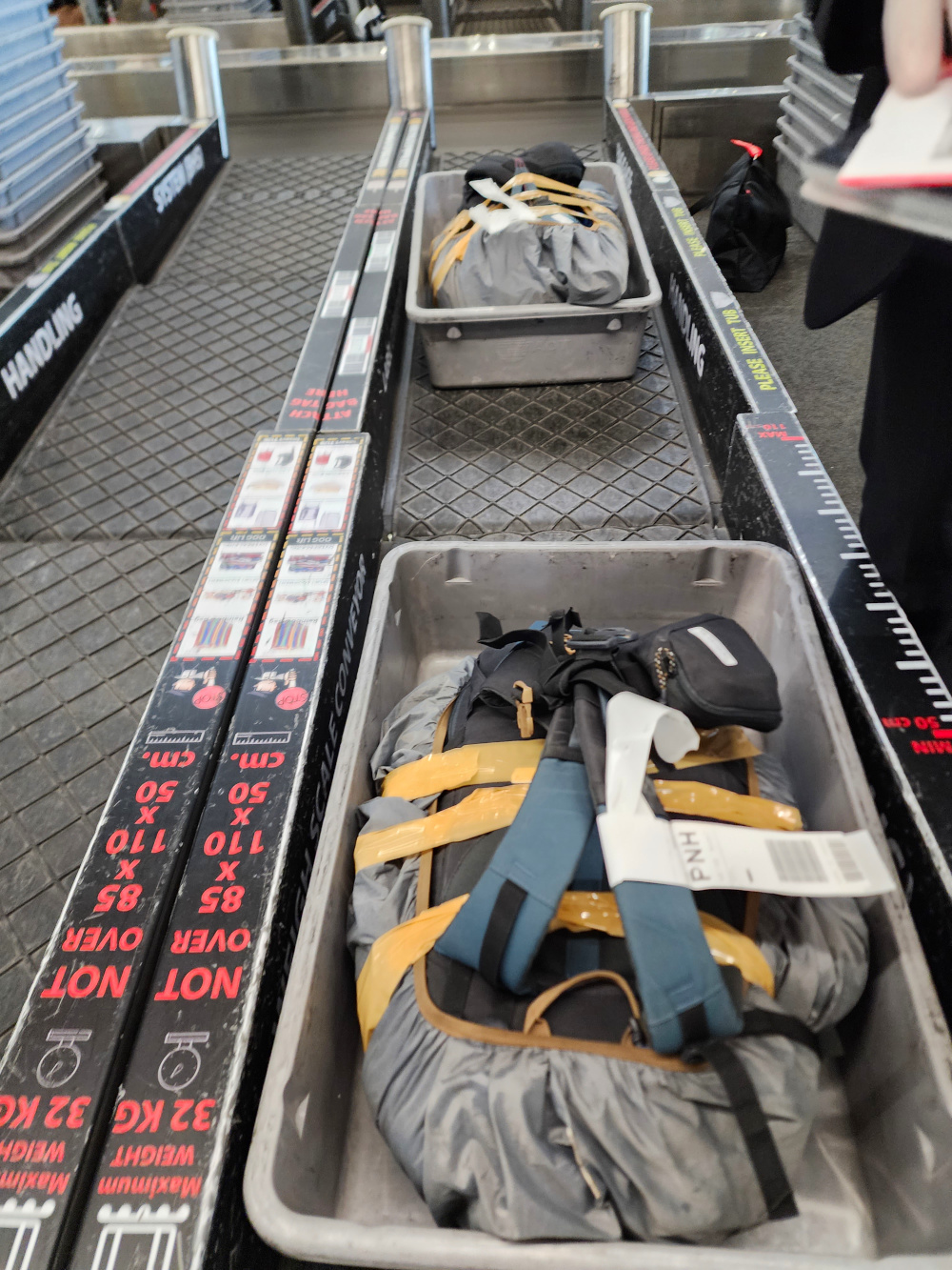 our backpacks on the conveyer belt to the airplane