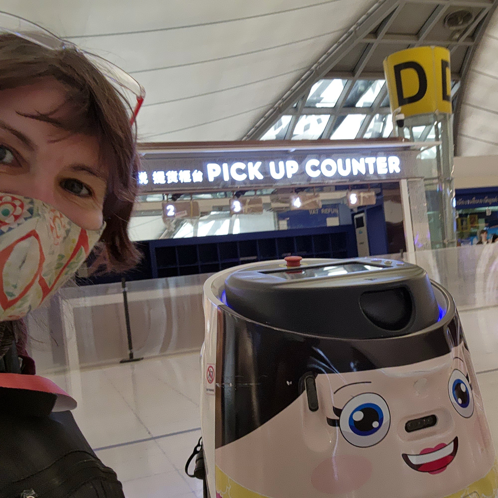 Friendly robot cleaner smiles for a photo