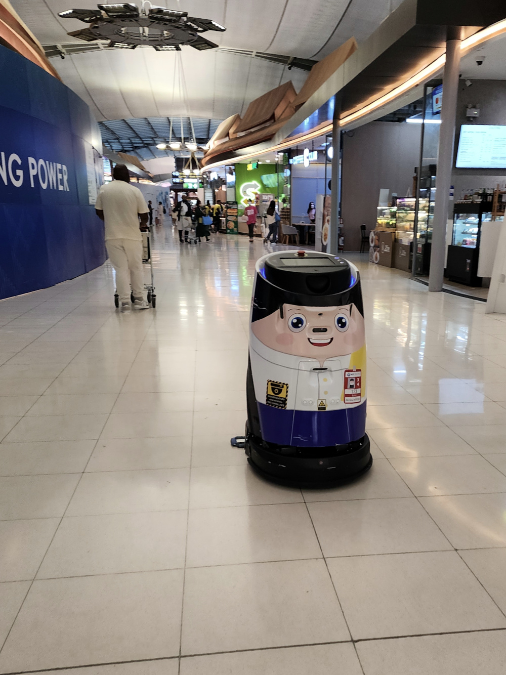 Friendly robot cleaner attending to their duties