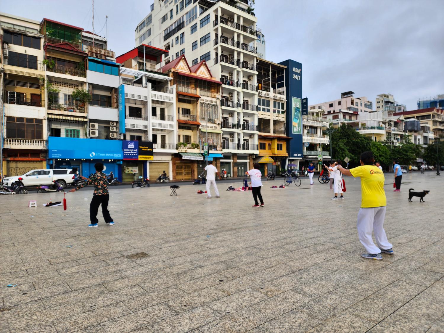 locals doing tai chi along the river from in Phnom Penh