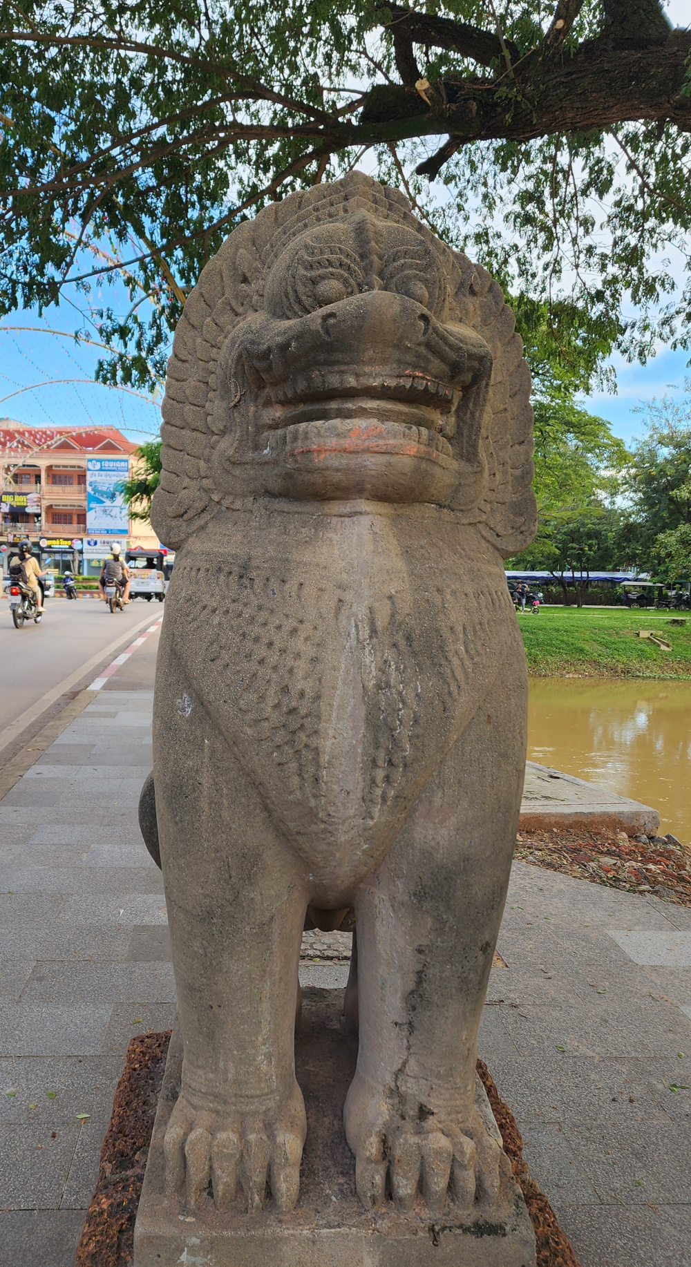 lion statue guarding the bridge in Siem Reap