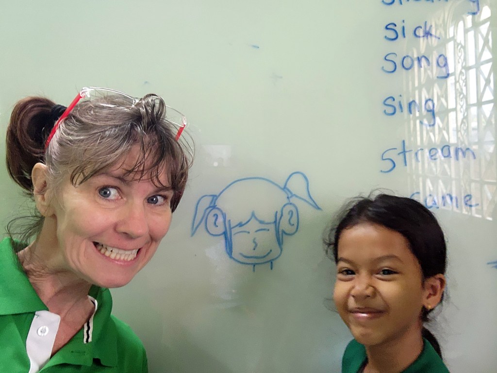 student drawing of Teacher Kimberly with pigtails