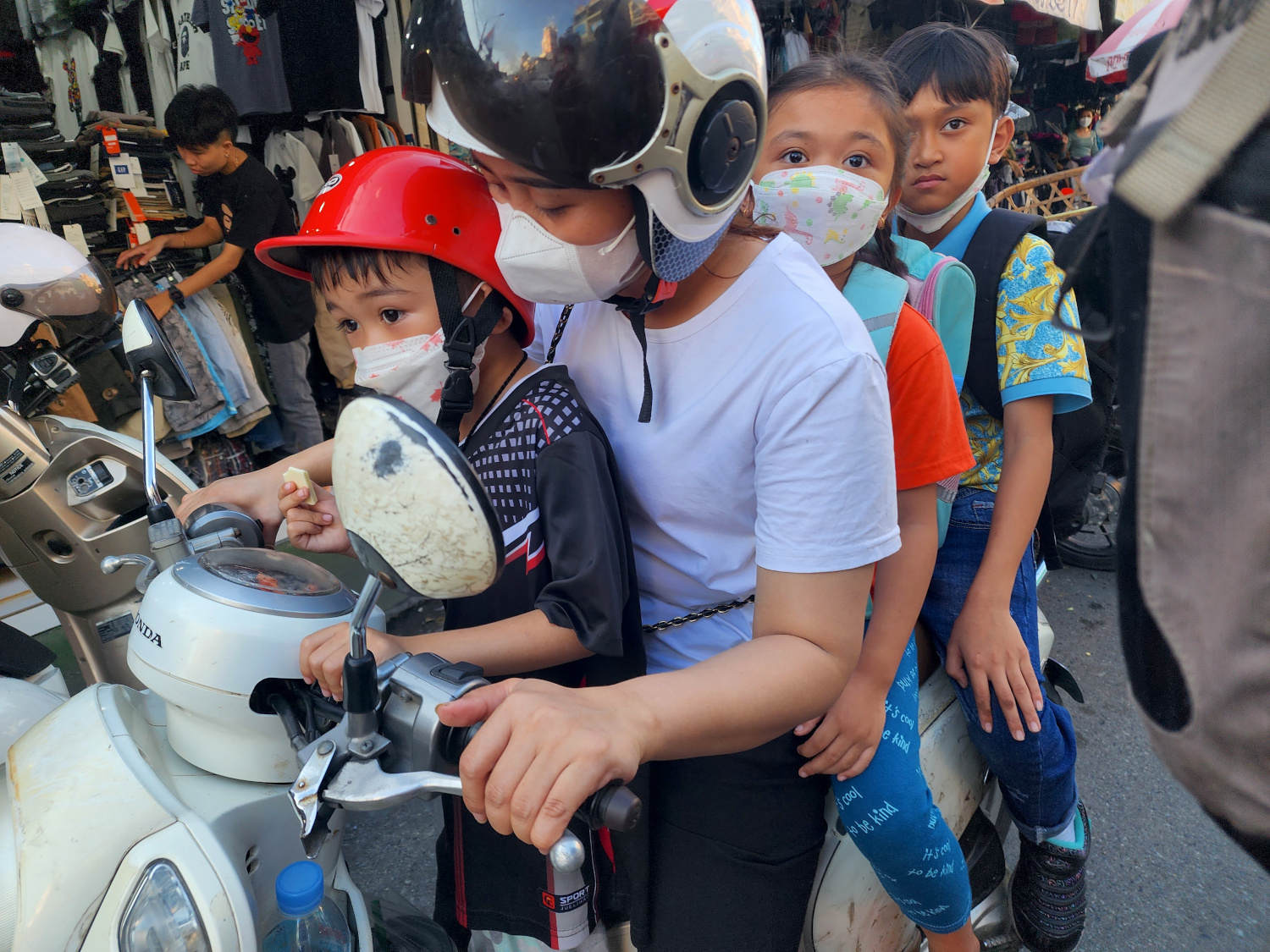 Family of Four on a moto near Russian Market, Phnom Penh