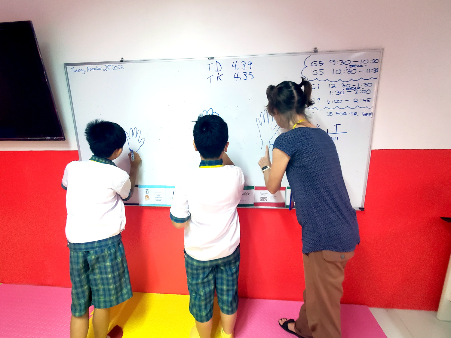 Hands on activity, students learning English vocab for parts of hand. Workaway volunteer teaching, Krou Yeung School, Phnom Penh