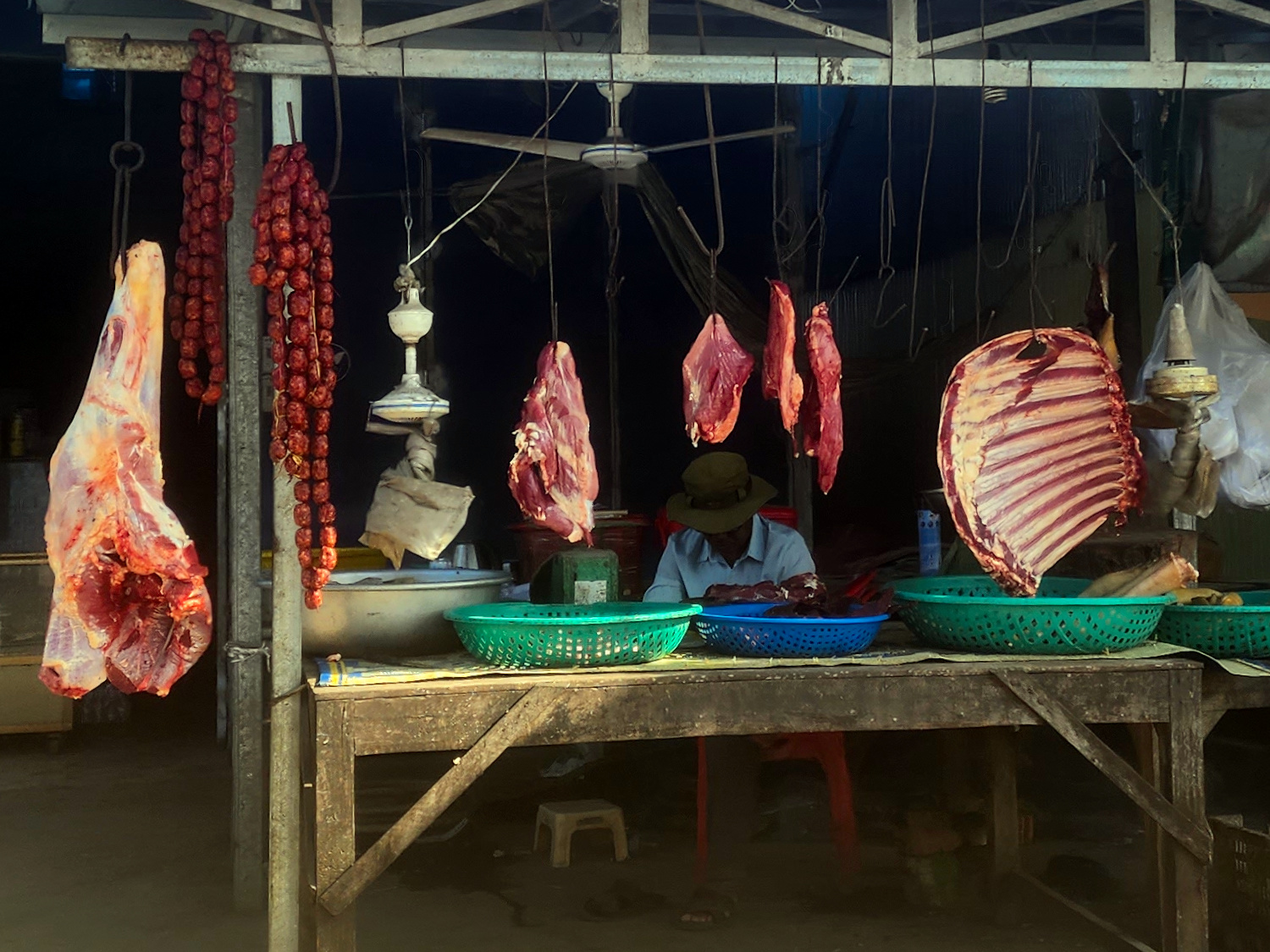 meat seller Phnom Sampov, Cambodia